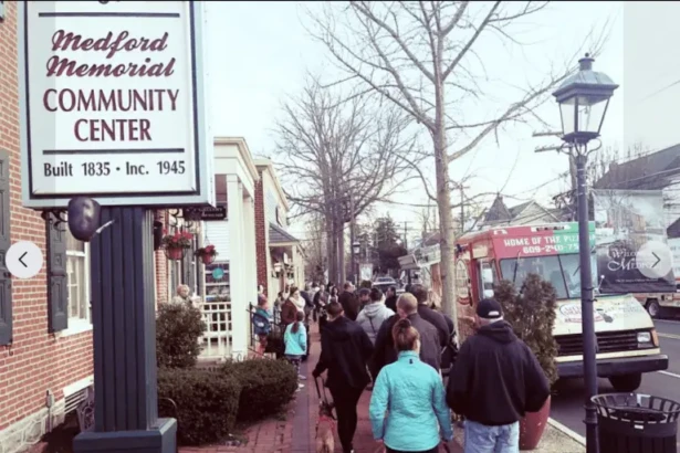 Food trucks and residents gathering on Medford Main Street during the Third Thursday community event.