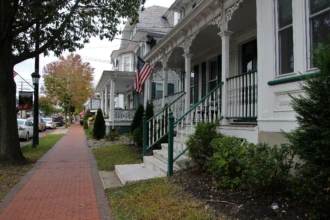 Historic homes and brick sidewalk along Main Street in Medford Village, New Jersey
