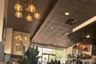 Cozy interior of a local Burlington County coffee shop with seating, warm lighting, and a welcoming café atmosphere.