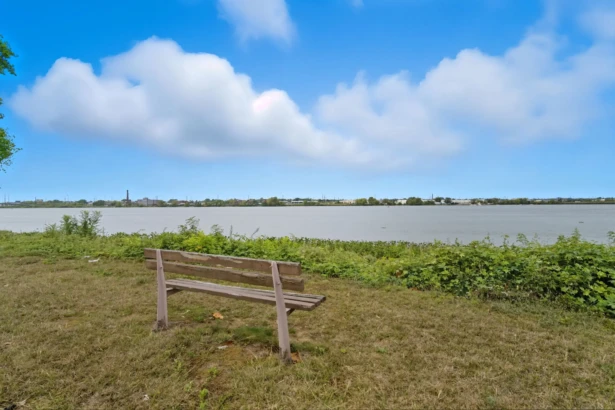 Wooden bench overlooking the Delaware River in Palmyra, New Jersey.