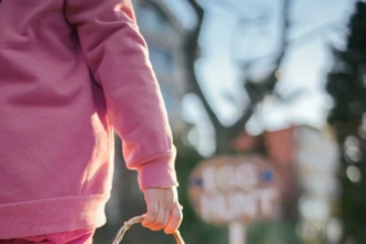 Child carrying basket during Easter egg hunt in Burlington County New Jersey