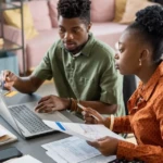 Couple reviewing tax paperwork at home in Burlington County NJ