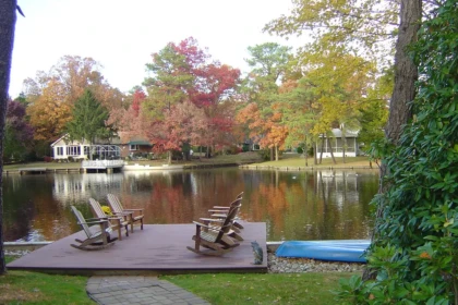 Lakefront deck and Adirondack chairs overlooking a Medford Lakes NJ waterfront in autumn