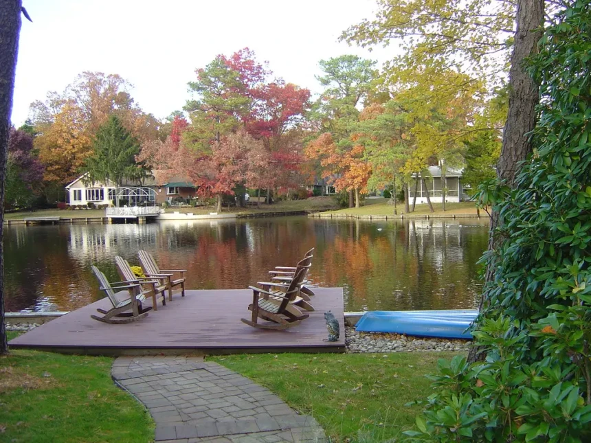Lakefront deck and Adirondack chairs overlooking a Medford Lakes NJ waterfront in autumn