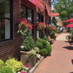 Main Street Moorestown NJ with outdoor dining, brick sidewalks, and storefronts